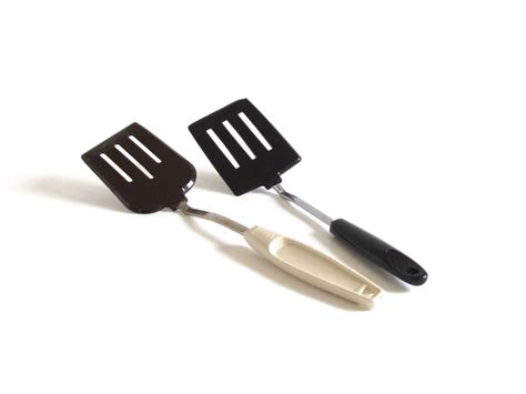 , which manufactured tin pans for bakeries. . Ekco spatula